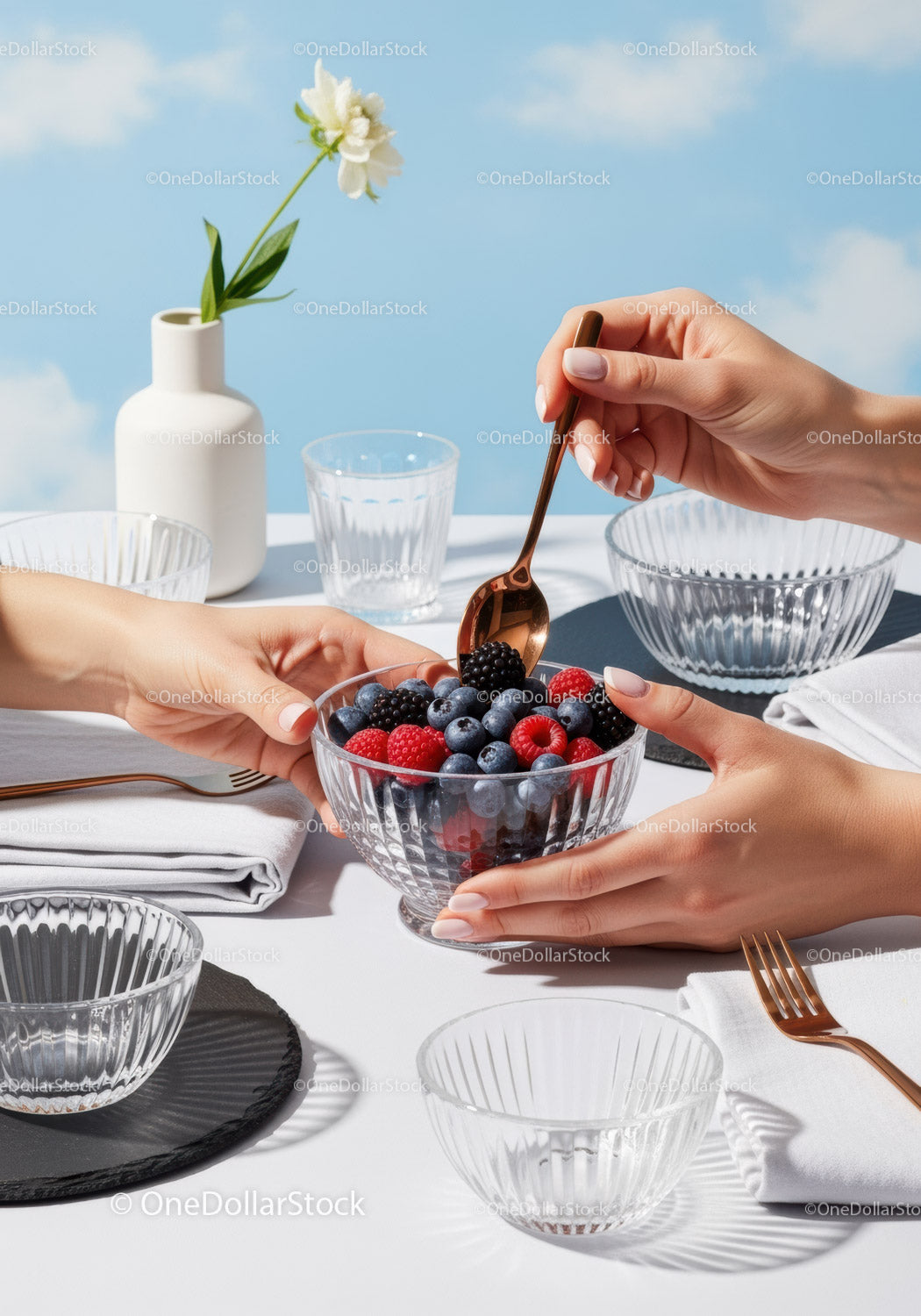 Fresh Assorted Berries in Glass Bowl on Stylish Outdoor Table