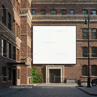 Blank billboard on historic red brick building facade