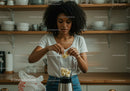 Young Woman Preparing Banana Smoothie in Modern Kitchen