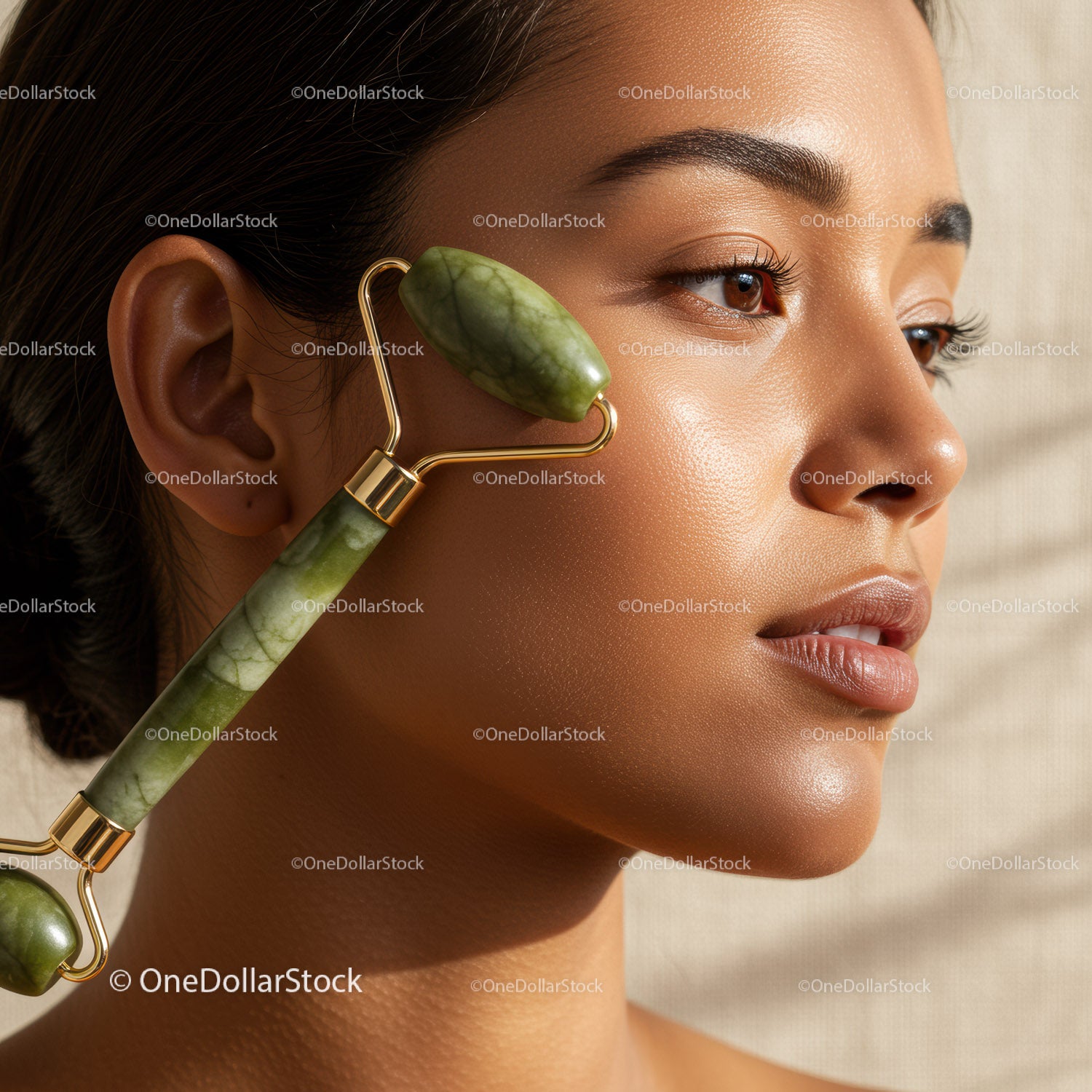 Beauty Woman Using Jade Roller for Facial Skincare and Relaxation