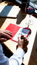 Man Writing Heartfelt Love Note by Window Light