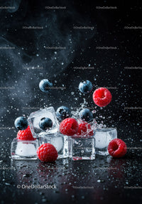 Refreshing ice cubes with fresh raspberries and blueberries splash