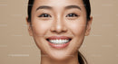 Close up of smiling young woman with flawless skin