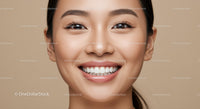 Close up of smiling young woman with flawless skin
