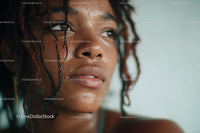Close-up of Water-Drenched Woman with Natural Beauty and Expressive Eyes