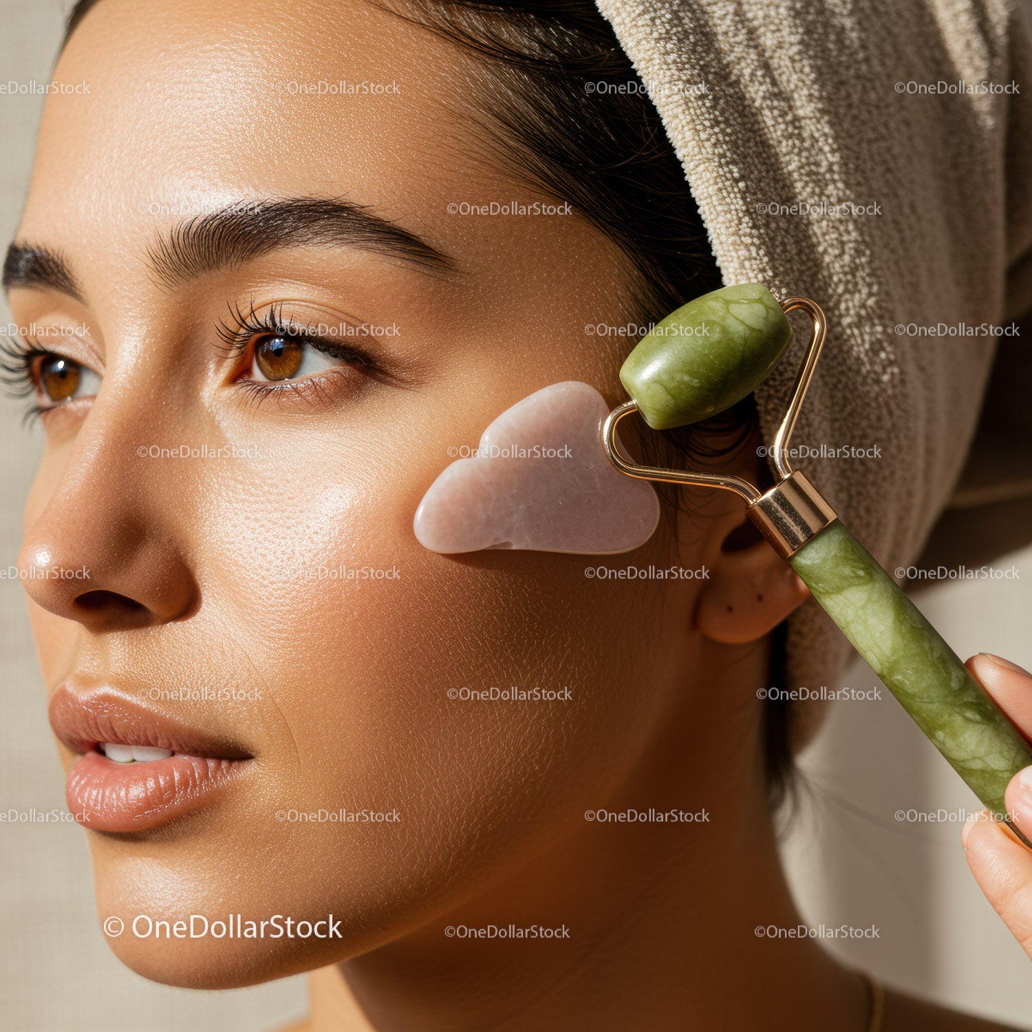 Close-up of a Woman Using a Jade Roller for Facial Massage