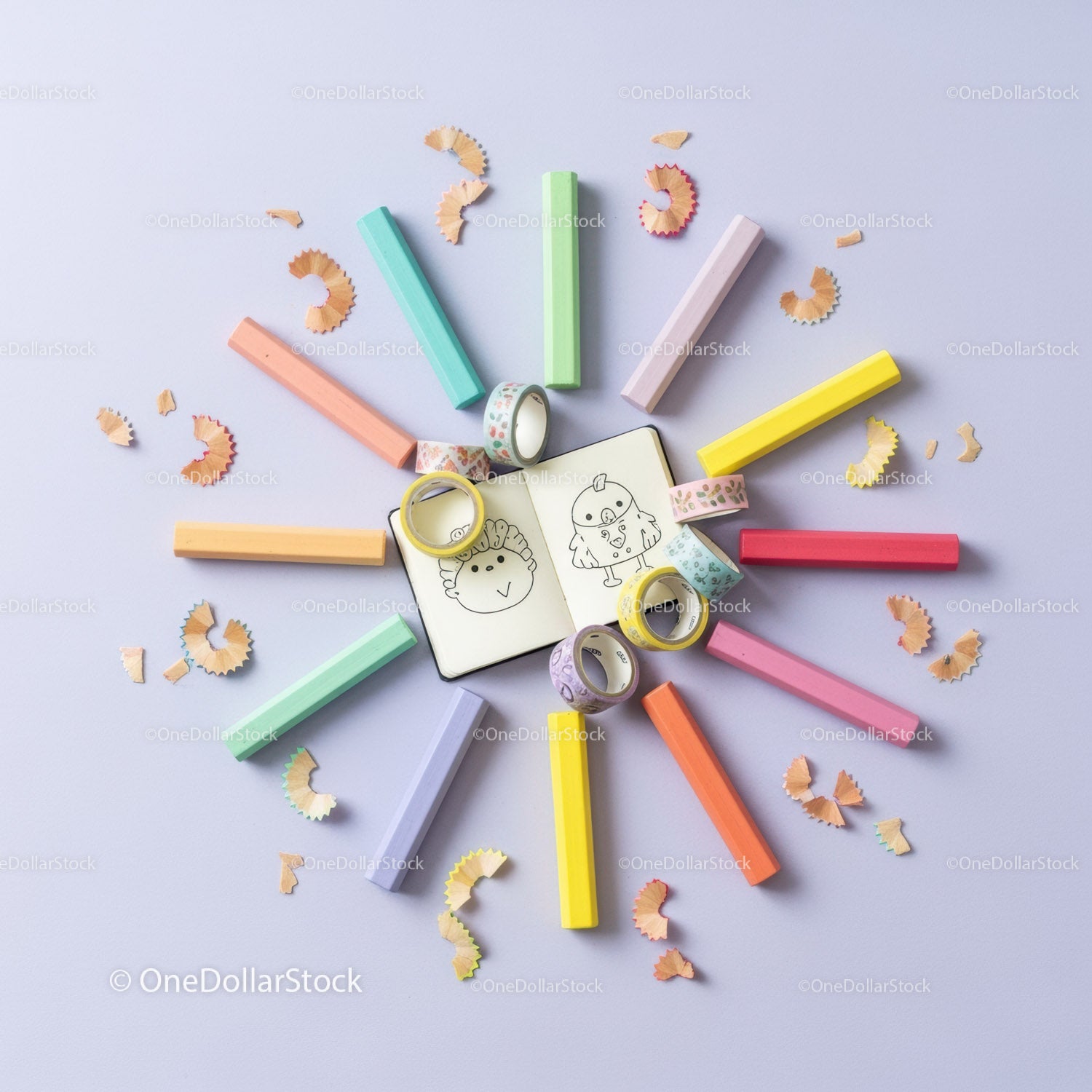 Colorful pastel chalks and creative doodles layout