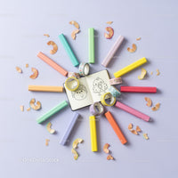 Colorful pastel chalks and creative doodles layout