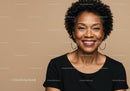 Confident Smiling Woman with Curly Hair and Hoop Earrings