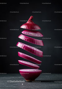 Floating slices of red onion against dark background
