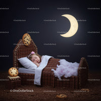 Sleeping girl in chocolate bed under crescent moon