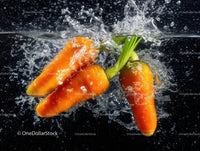 Fresh Orange Carrots Splashing in Water Over Black Background