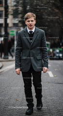 Teenage boy walking down urban street in autumn outfit