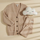 Cozy knitted cardigan and soft leggings set flat lay