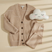 Cozy knitted cardigan and soft leggings set flat lay