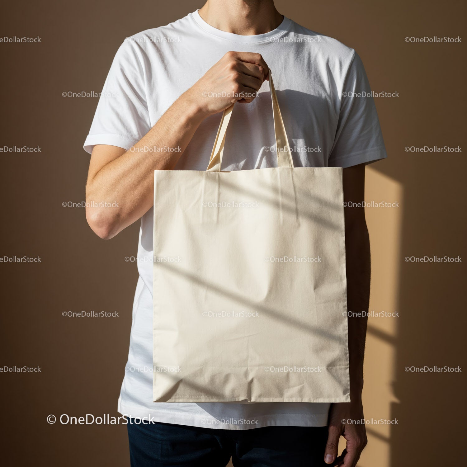 Man holding blank beige reusable canvas tote bag