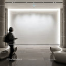 Modern gallery interior with illuminated white wall