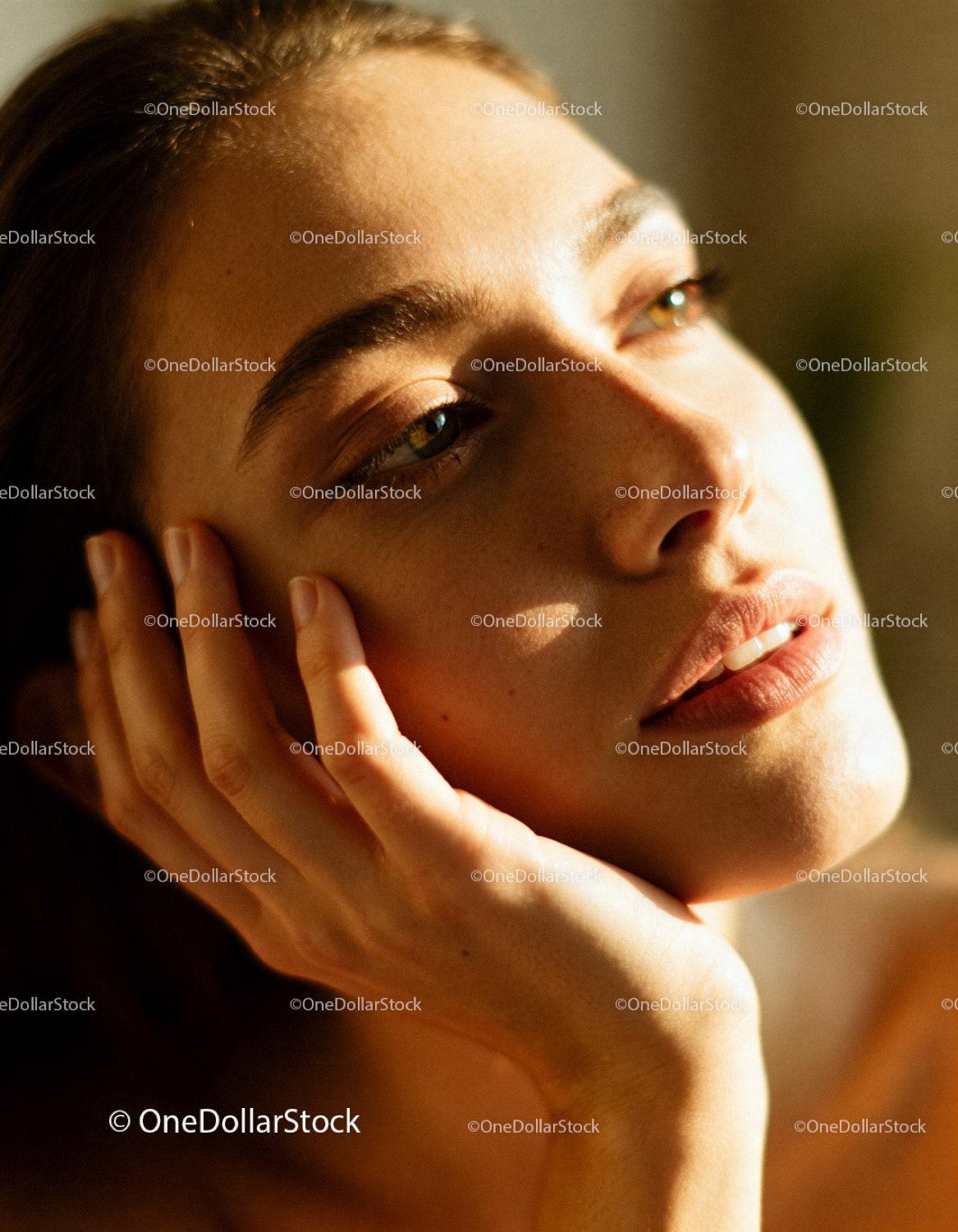 Close-up of woman enjoying soft sunlight on her face