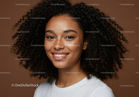 Portrait of a Happy Young Woman with Curly Hair and Bright Smile