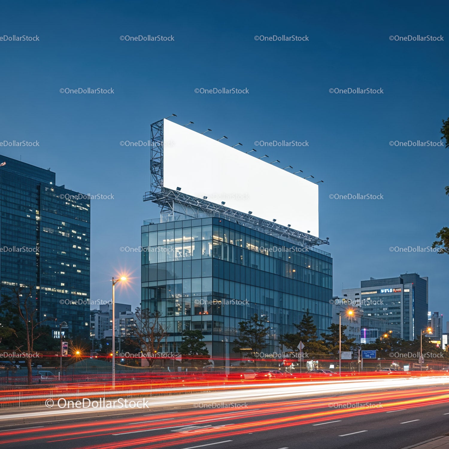 Urban office building with large blank billboard at dusk