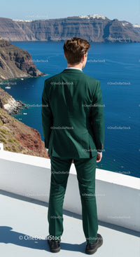 Man in Green Suit Gazing at Coastal Cliffs and Ocean