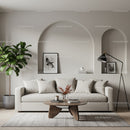 Modern living room with neutral sofa and green plant