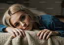 Young Woman Resting on Cozy Carpet with Serene Expression