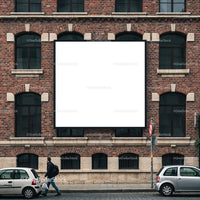 Urban Man Walking Past Blank Billboard on Brick Wall