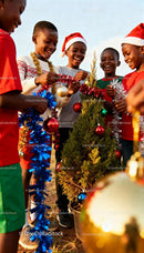 Children joyfully decorating small outdoor Christmas tree