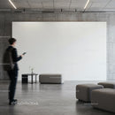 Modern minimalist lobby with seating and blank wall