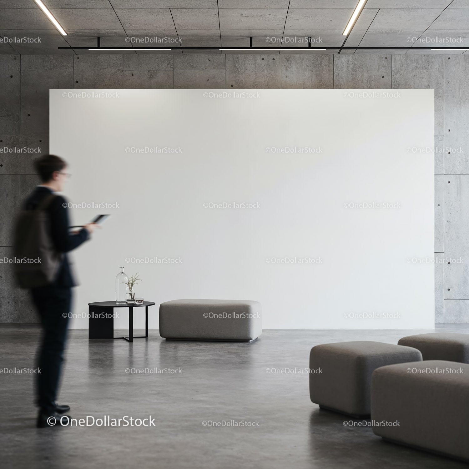 Modern minimalist lobby with seating and blank wall