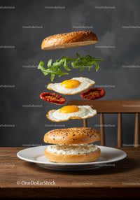 Bagel sandwich with fried eggs and sun dried tomatoes