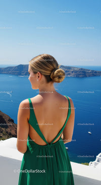 Woman in Green Dress Enjoying Stunning Ocean View