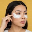 Young Woman Applying Under Eye Patches for Skincare Treatment