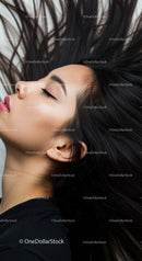 Close up of serene woman with flowing black hair