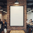 Blank poster on brick wall in cozy cafe interior