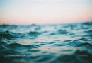 Calm Blue Ocean Waves with Gentle Ripples and Sky Reflection