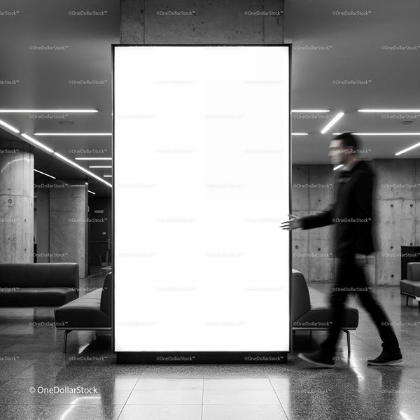 Blurred man walking past illuminated blank billboard indoors JPG Mockup Image