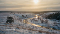 Winter River Winding Through Frosty Snowy Hills