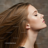 Profile of serene young woman with flowing hair