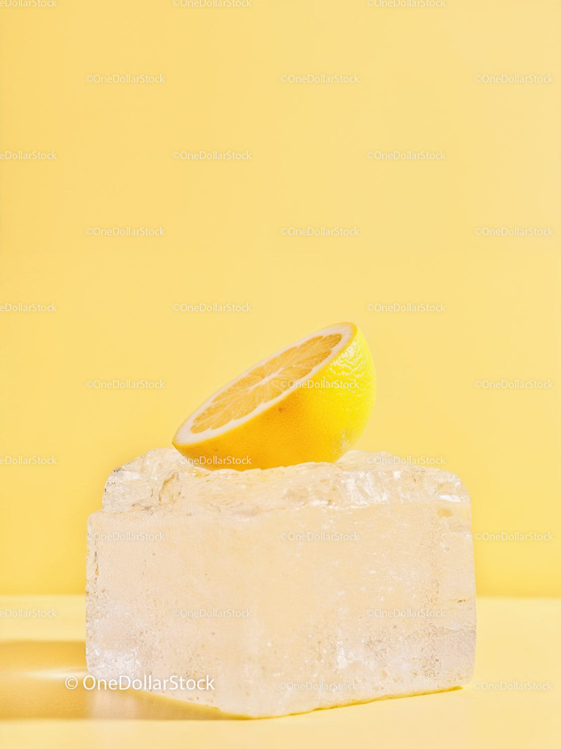 Fresh Lemon Half Balanced on Large Ice Cube