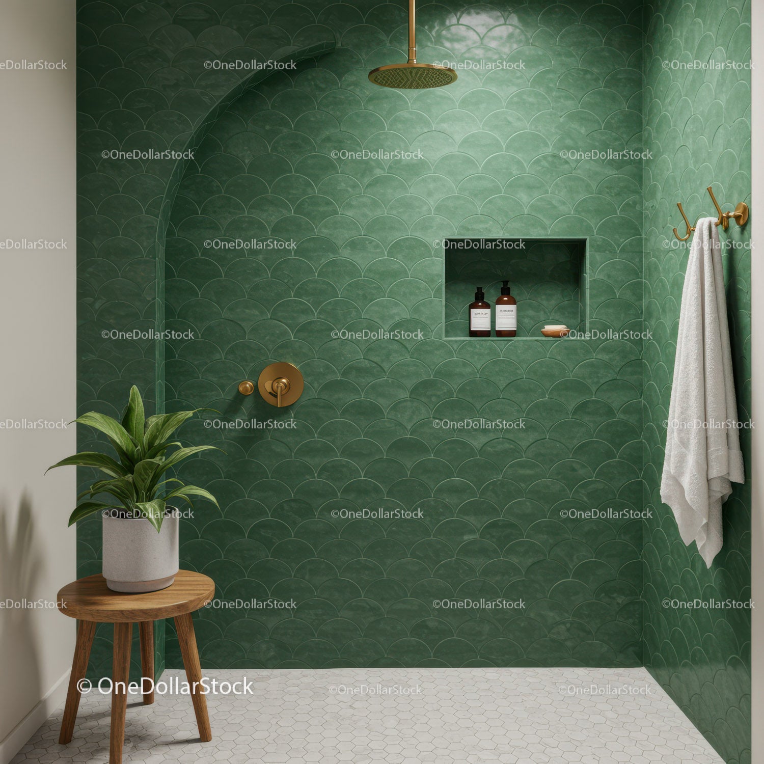 Minimalist green tiled shower with elegant brass fixtures