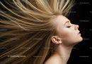 Blonde woman with flowing hair and closed eyes
