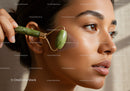 Young Woman Receiving Facial Massage with Jade Roller for Healthy Skin