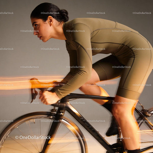 Focused cyclist riding indoors with motion blur effect