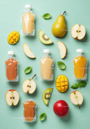 Assorted Fresh Fruit Purees and Whole Fruits on Blue Background
