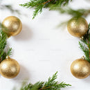 Golden Christmas Ornaments with Green Pine Branches Frame