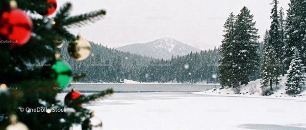 Snowy Mountain Lake with Festive Christmas Tree Ornaments