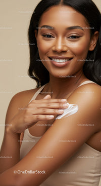 Portrait of Smiling Woman Applying Lotion Showing Healthy Skin