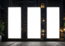 Three Illuminated Vertical Billboards in Urban Night Setting